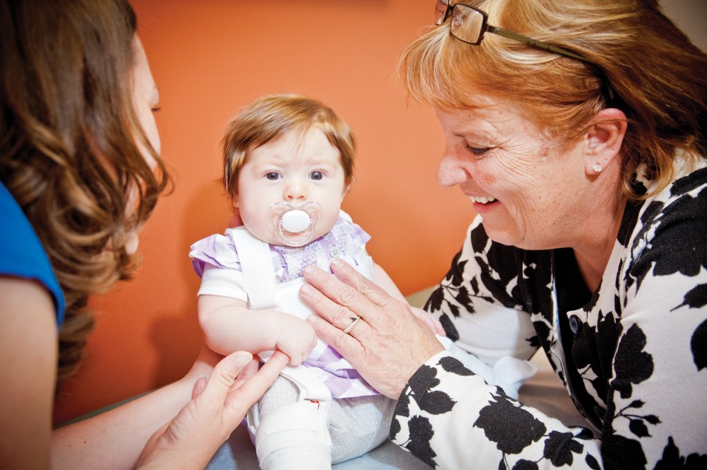 Dr. Laurel Benson, a pediatric orthopedic surgeon at Rocky Mountain Pediatric Orthopedics (right), spends time with her precious patient, Stella Alden.