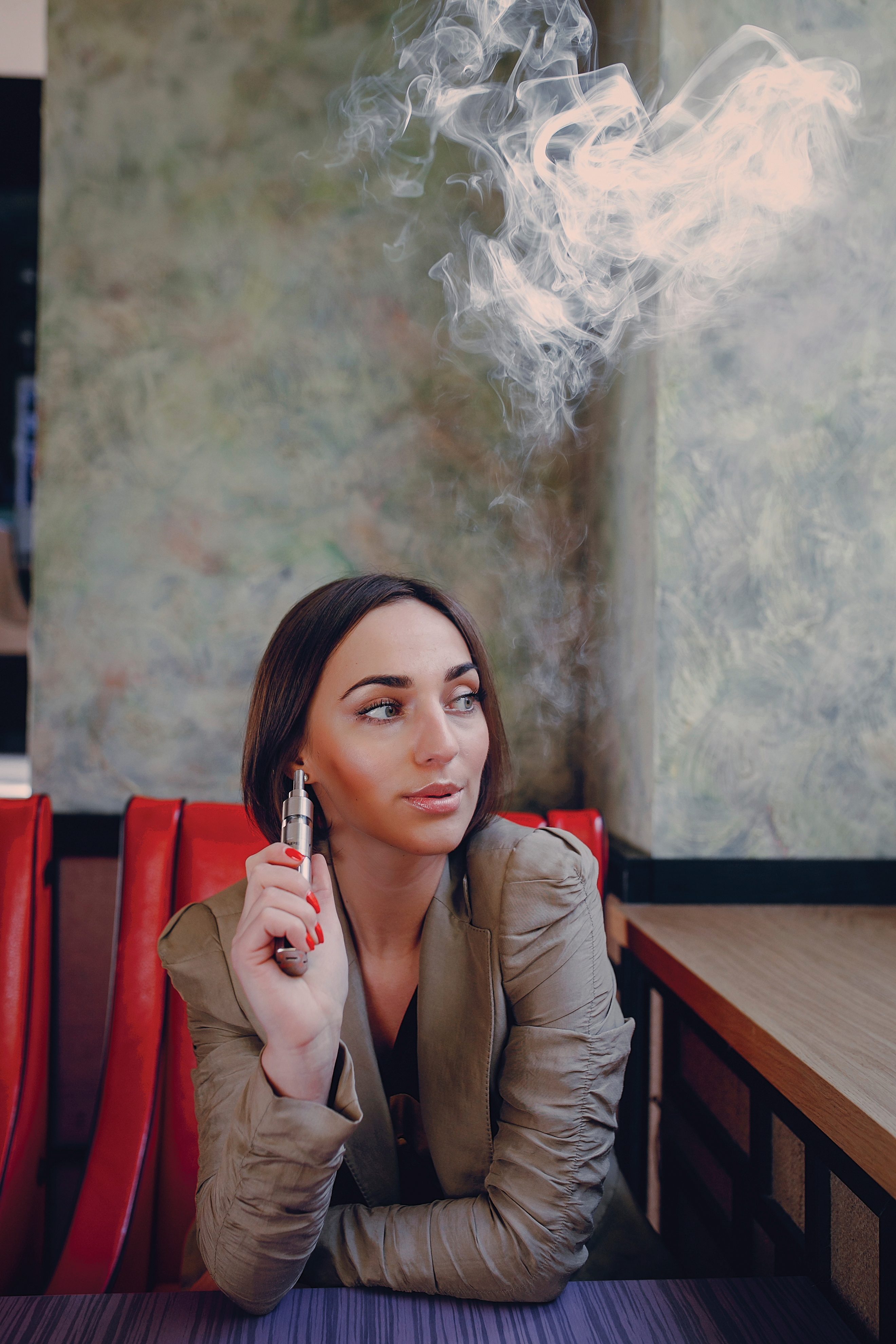 young woman smoking electronic cigarette