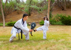 Woosik Chung, spine surgeon teaches his son taekwondo